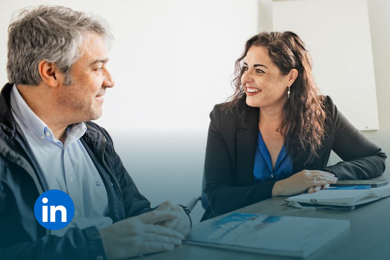Ana Molina smiles and listens attentively to a customer.